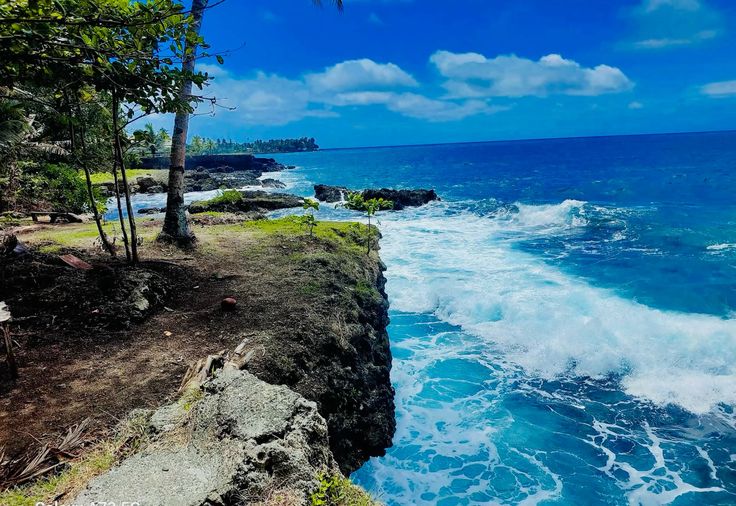 Turquoise waters and lush tropical coastline in Madang Province
